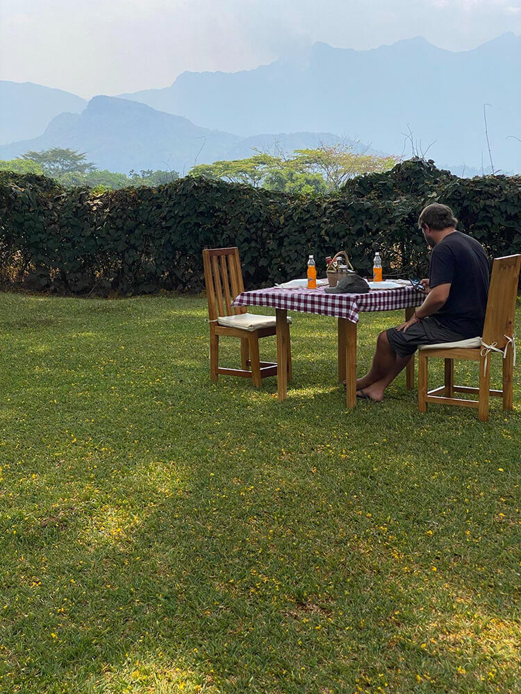 Eating dinner in the garden with view to Mount Mulanje