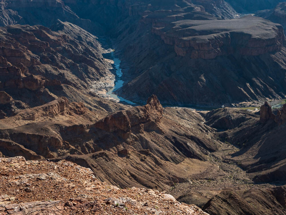 River at bottom of large canyon